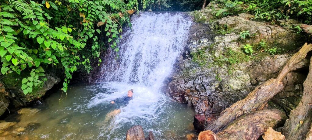 swimming in waterf`all at bottom of trek