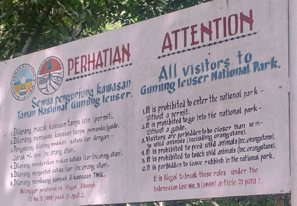 Park rules a photo taken from the entrance to Gunung Leuser National Park explaning how to ethically see the Orangutan