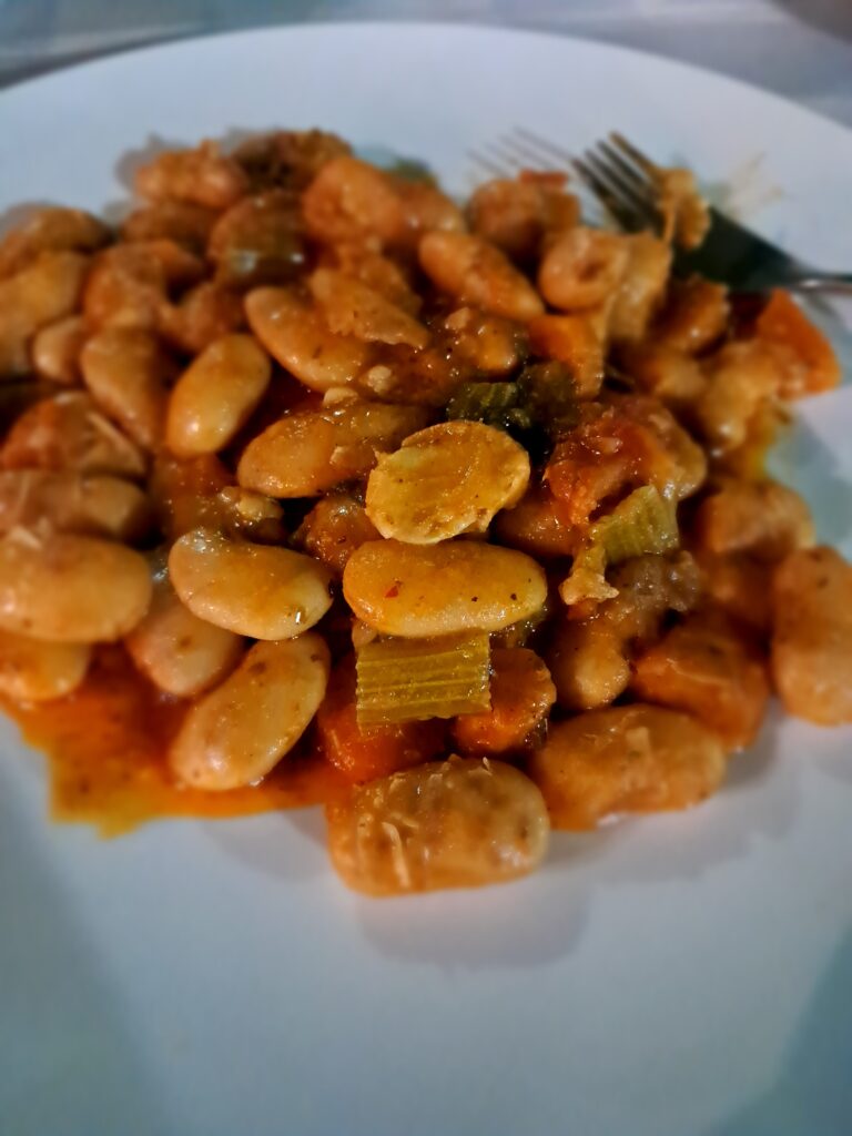 Gigantes plaki, giant white beans baked in tomato sauce, a naturally vegan traditional Greek dish at a Kalambaka restaurant near Meteora