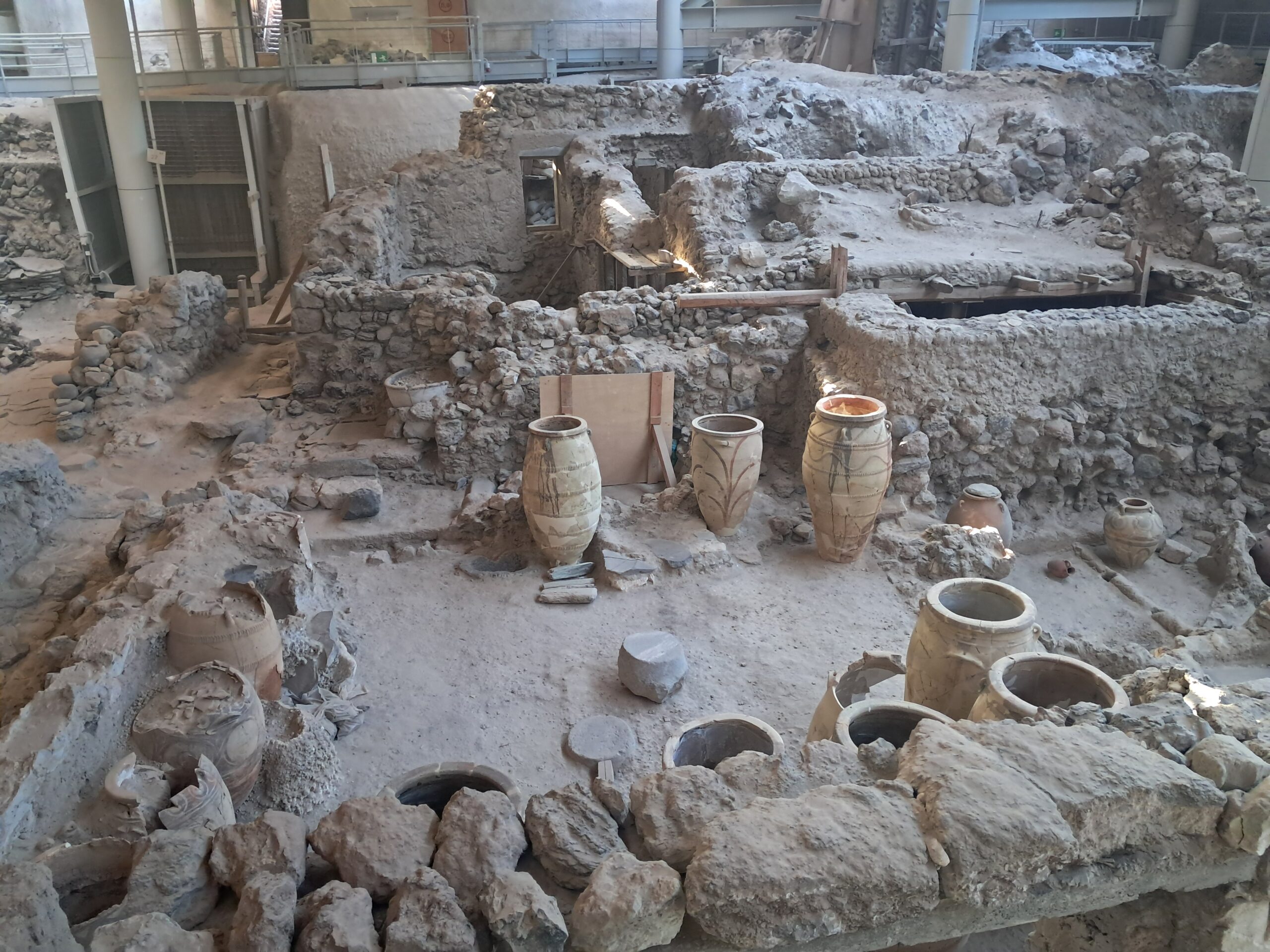 Ancient pottery and ruins inside the Akrotiri archaeological site Santorini