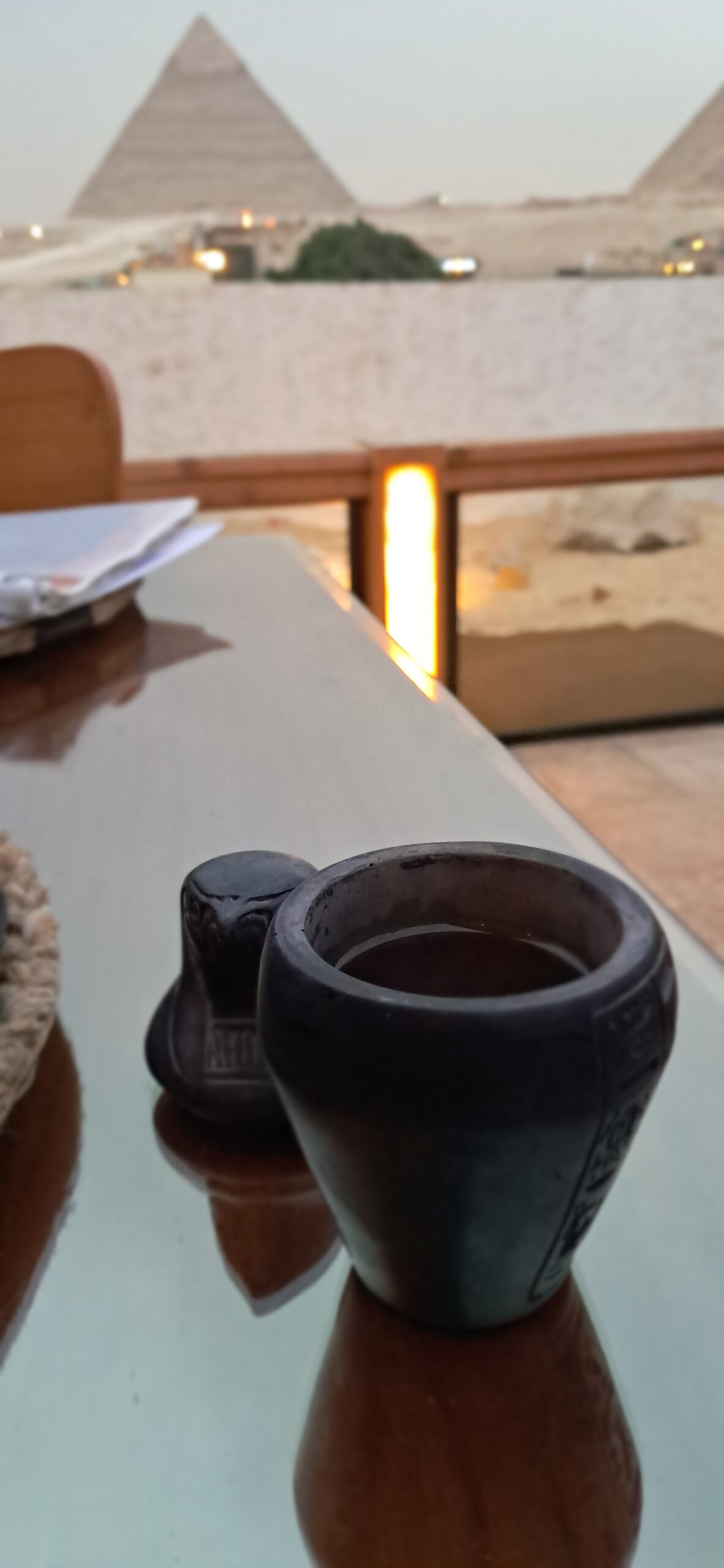 Egyptian coffee served at a rooftop restaurant with the Giza Pyramids visible in the background