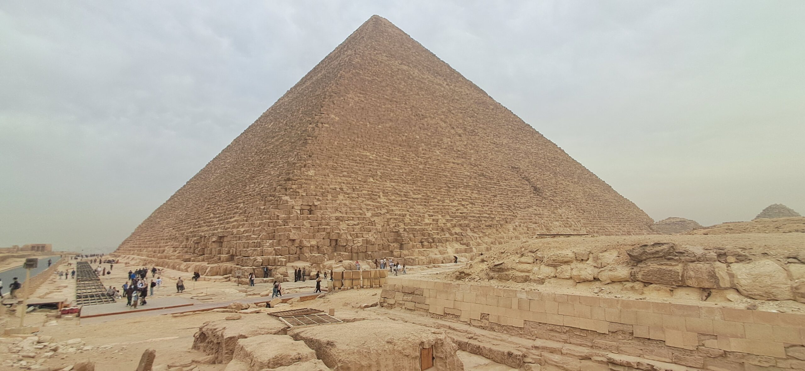 The Great Pyramid of Giza on a hazy January morning, where tourists are offered the chance to ride a camel at the Pyramids