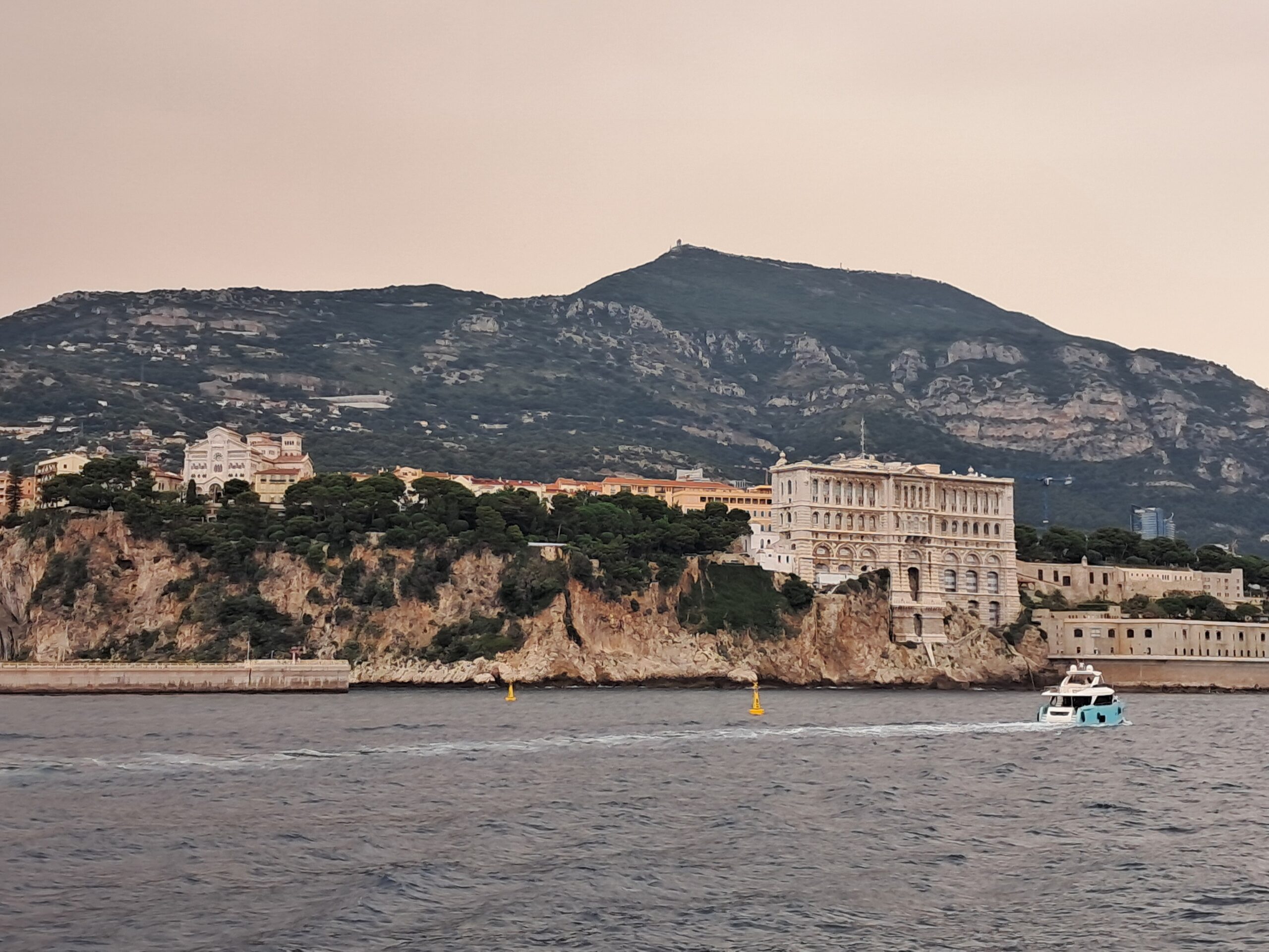 The coast of Monaco seen from the water while arriving by boat past the cliffs