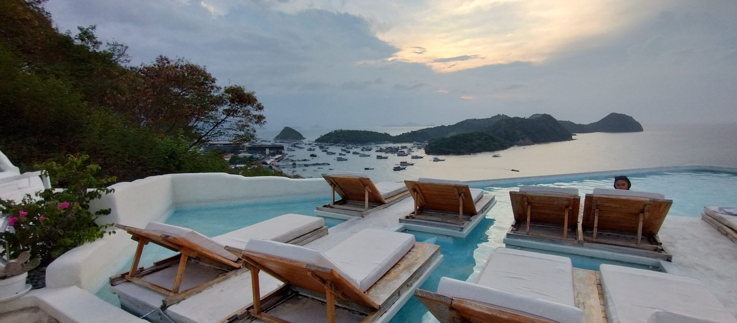 Rooftop pool at the Loccal Collection Hotel looking out over Labuan Bajo bay at sunset