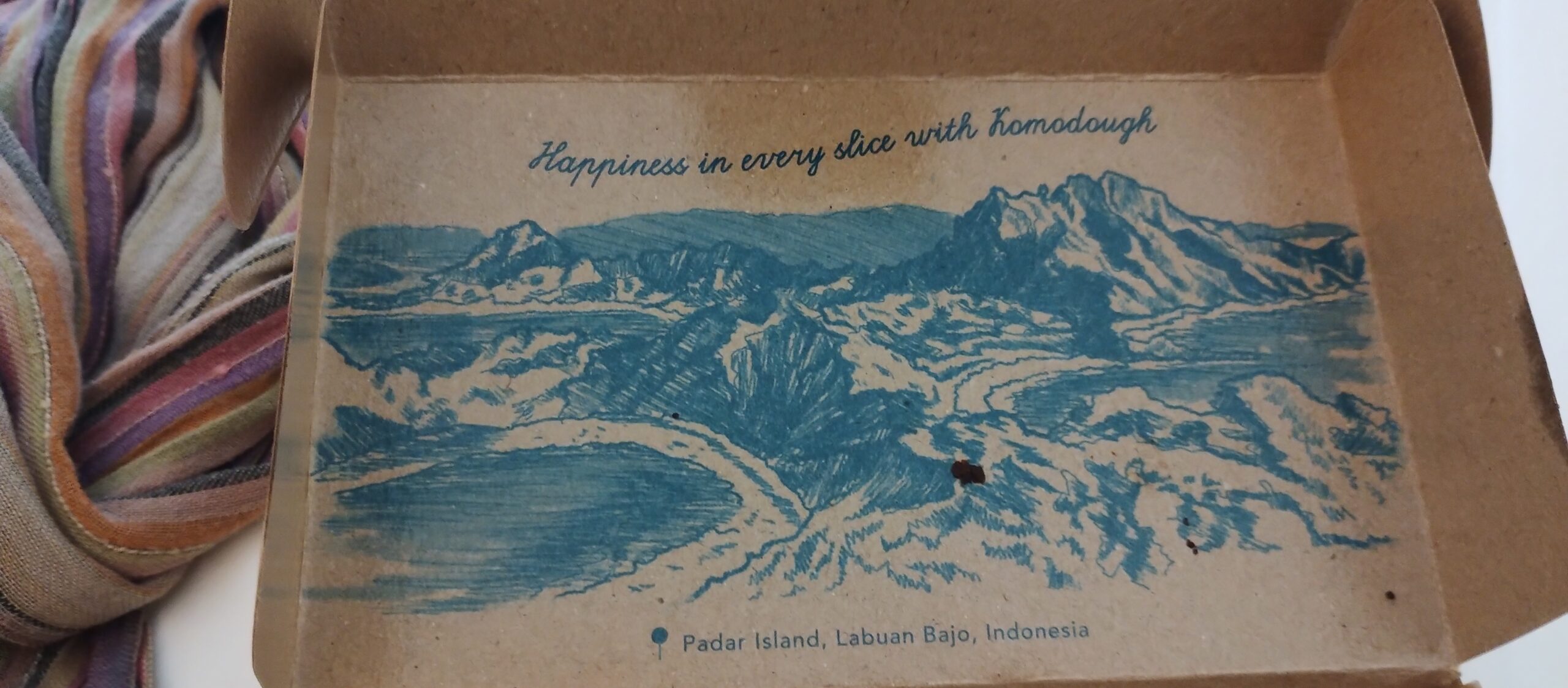 Illustrated Komodough bakery box showing Padar Island