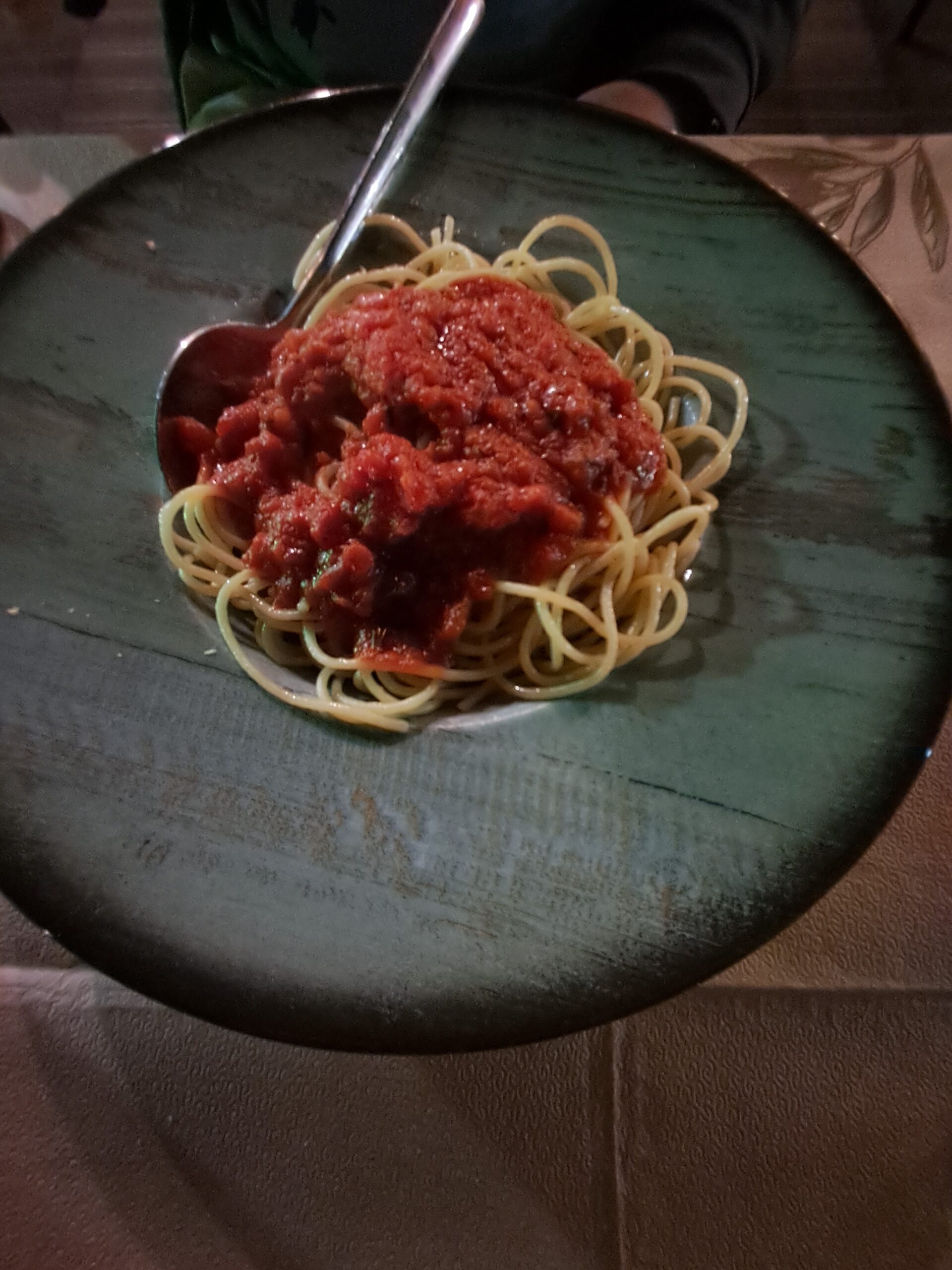 A plate of spaghetti with tomato sauce, a reliable vegan fallback