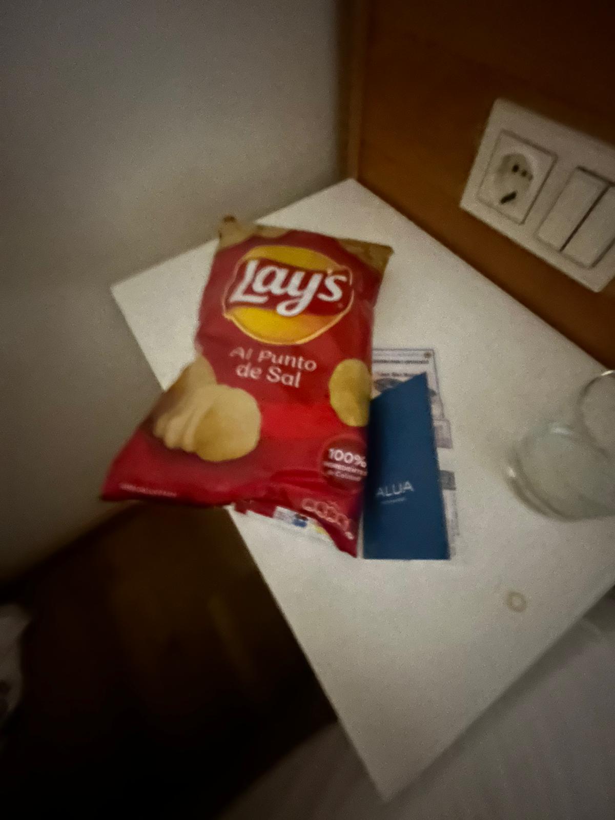 A packet of crisps on a hotel desk, sometimes the only vegan snack around