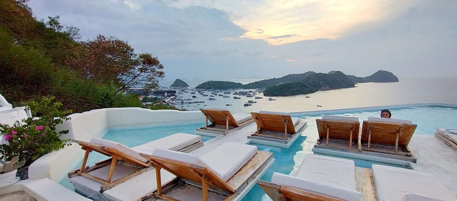 Rooftop pool at the Loccal Collection Hotel looking out over Labuan Bajo bay at sunset