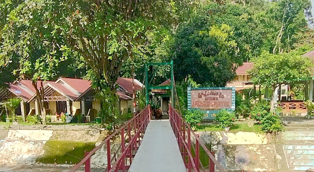 The suspension bridge crossing the Bohorok River at the start of Day Two of the Bukit Lawang jungle trek, at the entrance to Gunung Leuser National Park