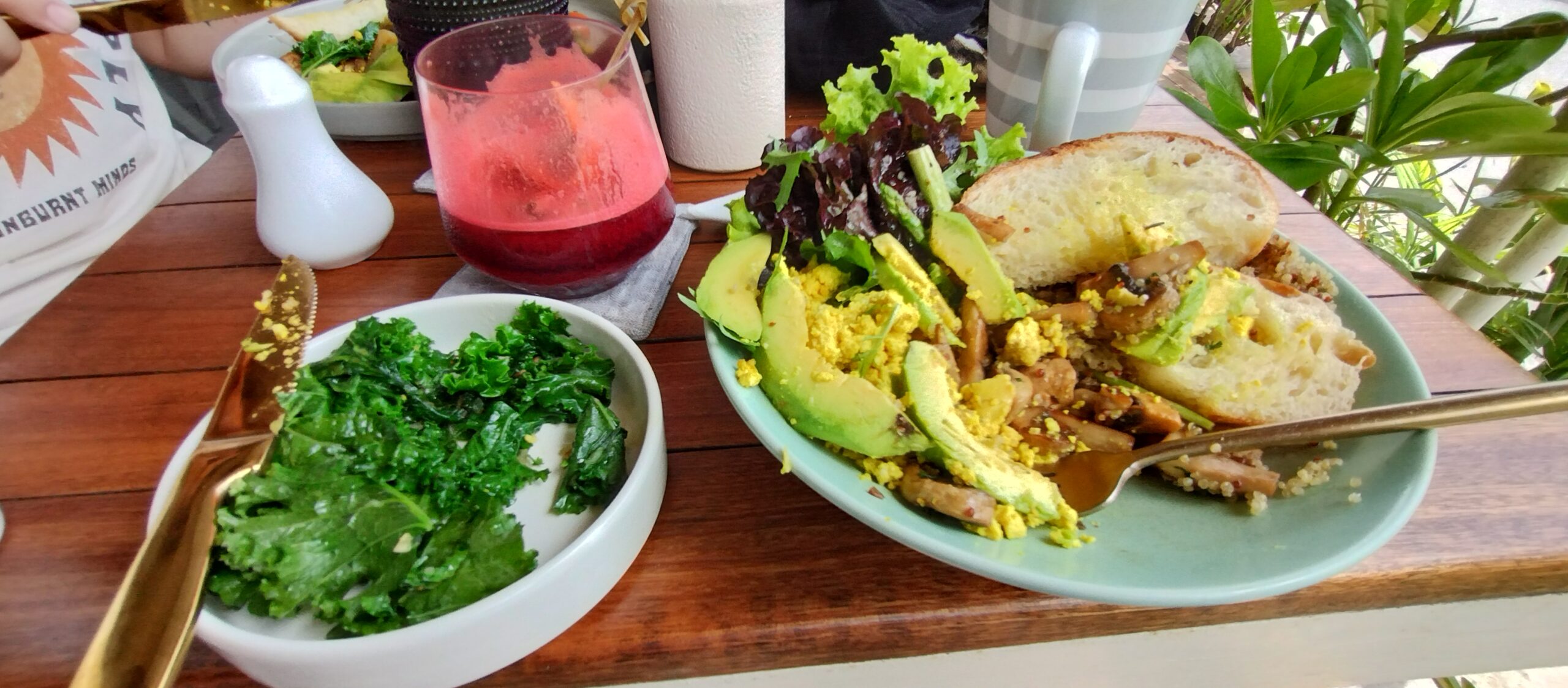 A bright vegan breakfast with avocado toast and kale at I Am Vegan Babe, Canggu